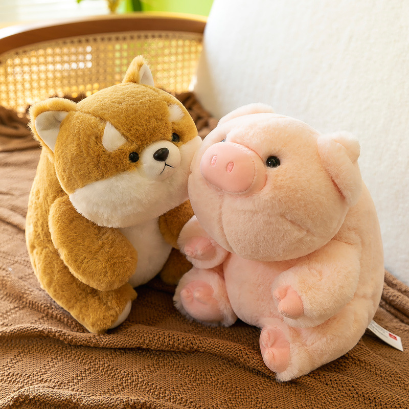 Close up of Shiba Inu and pig companion plush toys with soft fabric and rounded shape, perfect for cuddling and everyday comfort