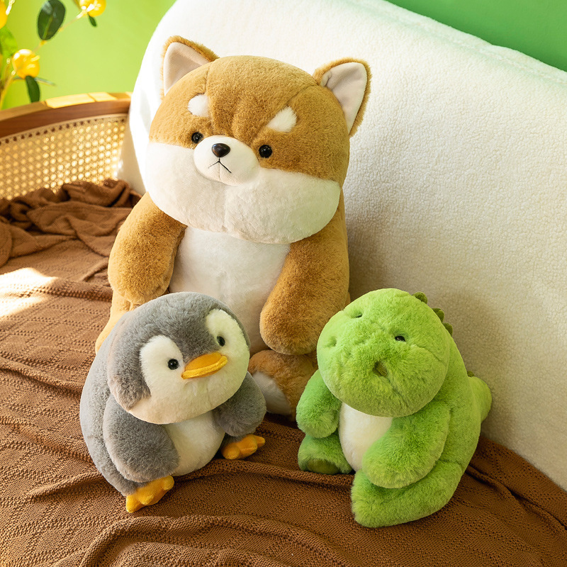 Shiba Inu, penguin and dinosaur companion plush toys on sofa with soft plush fabric, cozy and cuddly for relaxing and everyday comfort