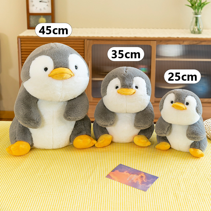 Penguin companion plush toy in 25 cm, 35 cm and 45 cm sizes showing soft fabric and rounded cuddly design for hugging and display