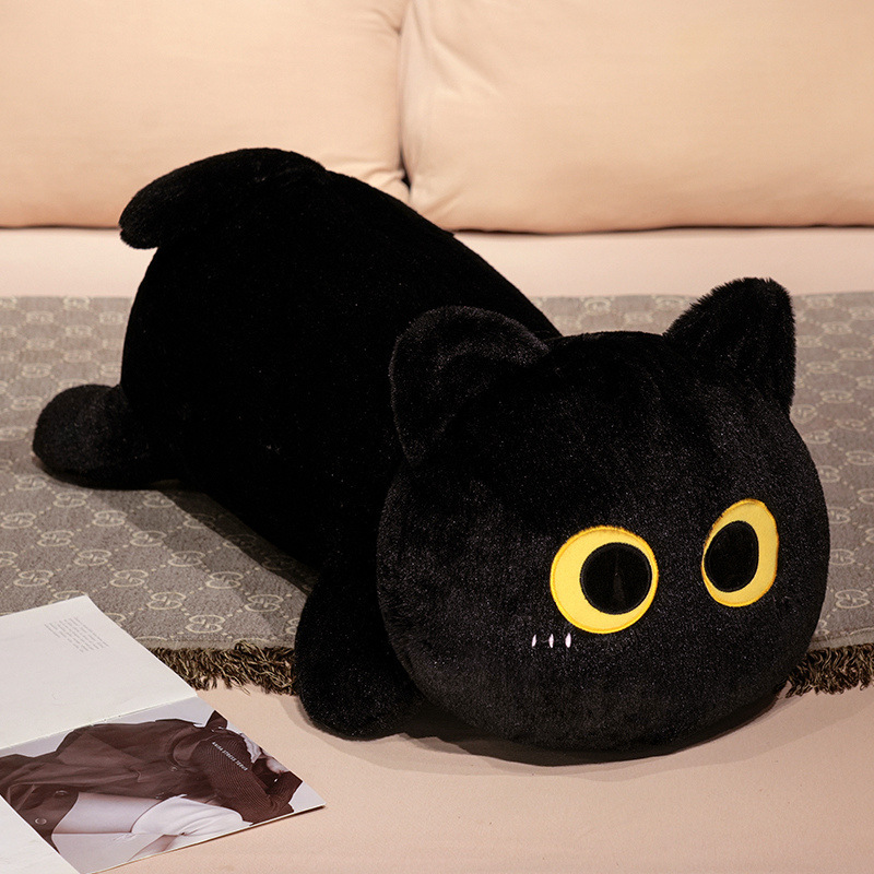 Black long cat plush pillow with big yellow eyes, soft stuffed body pillow in lying cat design for hugging and home decor