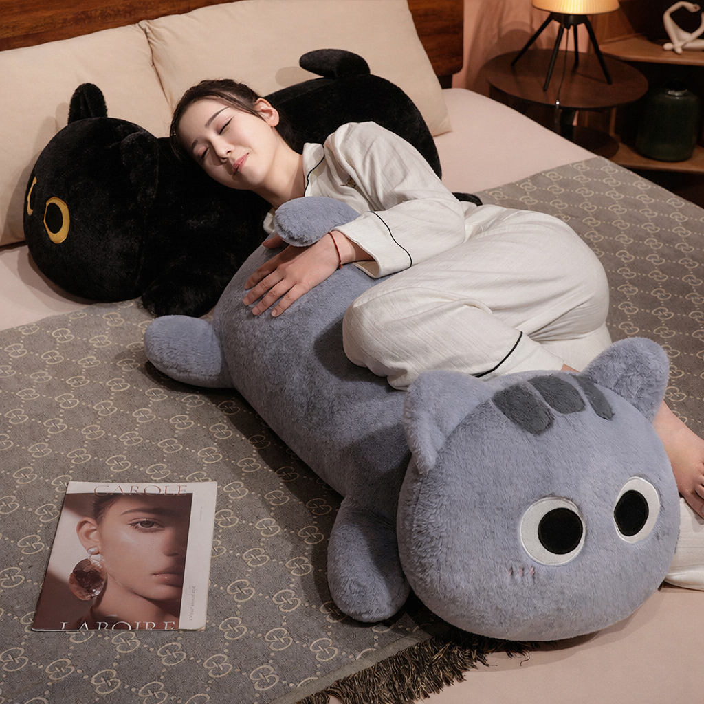 Long cat plush pillow in gray used for hugging and sleeping on a bed, soft body pillow design for comfort and relaxation