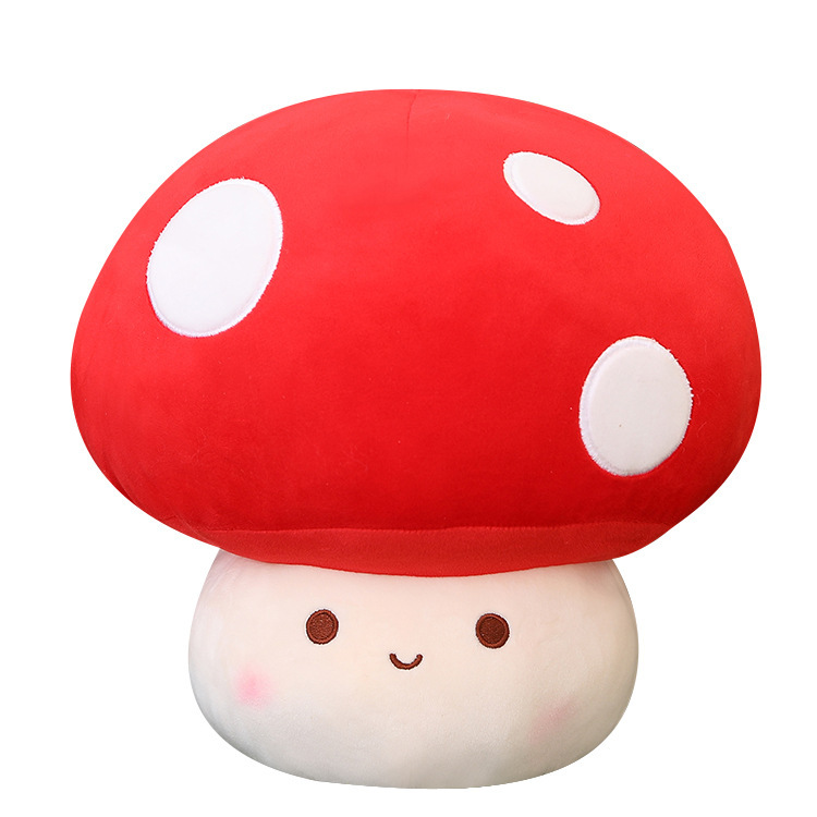 Red mushroom plush toy with a cute smiling face, featuring a soft plush surface and rounded shape, perfect as a cuddly stuffed toy or decorative cushion