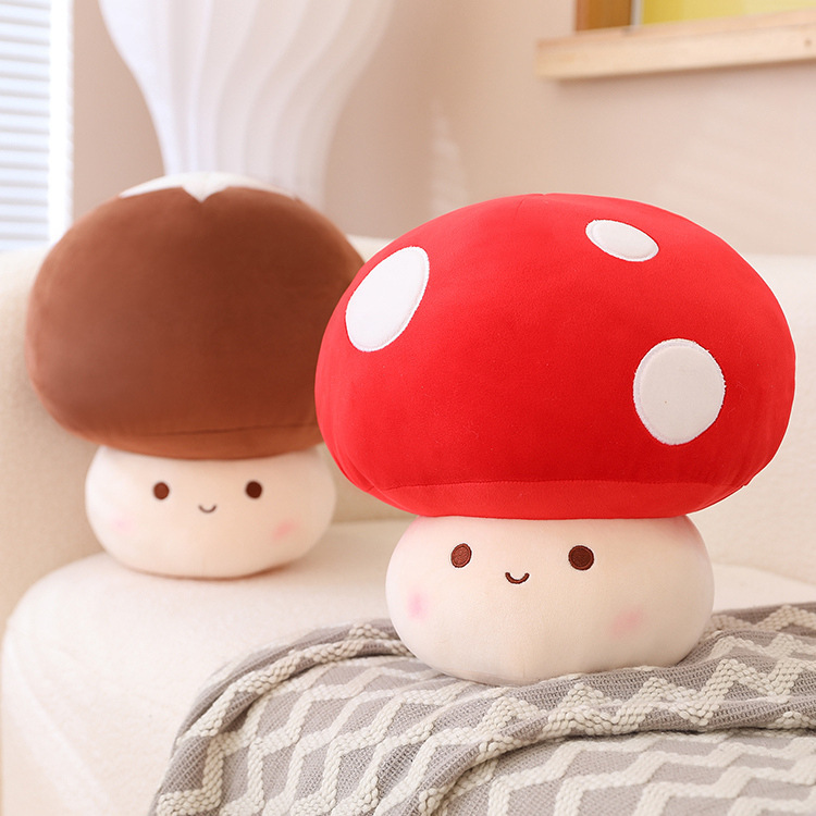 Red and brown mushroom plush toys with soft textures displayed on a sofa, adding a warm, playful, and cozy touch to bedroom or living room decor