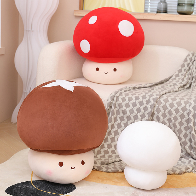 Mushroom plush toys in red, brown, and white colors placed on a sofa and floor, adding a soft, cozy, and playful touch to living room or bedroom decor
