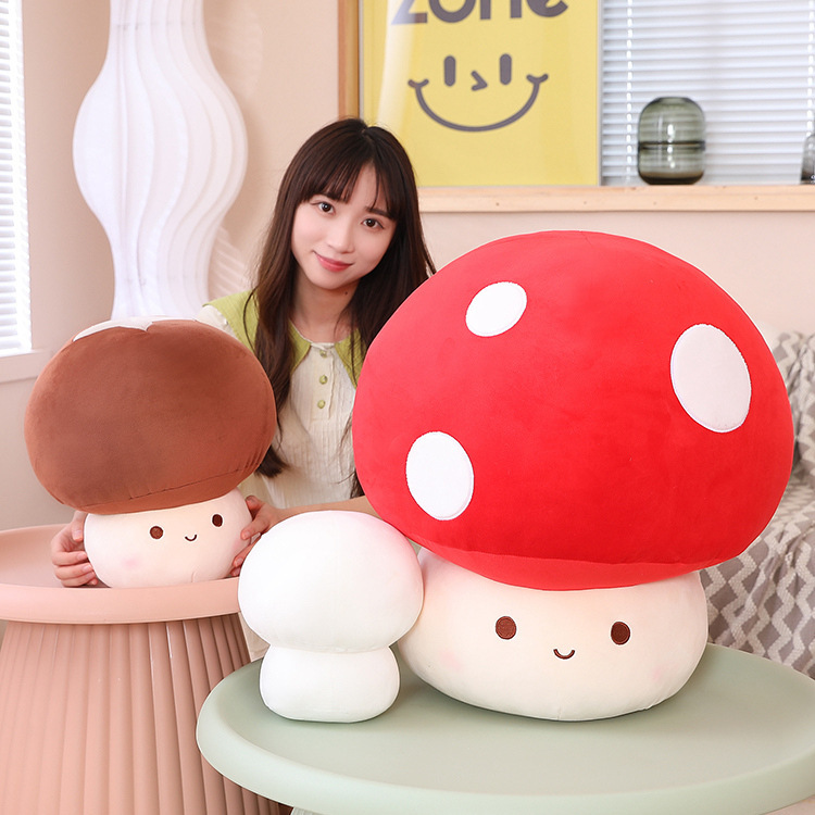 Mushroom plush toys in red, brown, and white designs displayed together, featuring soft textures and different sizes, perfect for hugging, decorating, and creating a cute and cozy indoor space