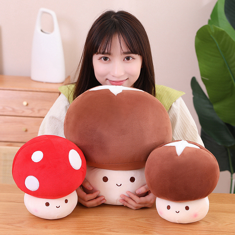 Mushroom plush toys in different sizes displayed together, featuring red and brown designs with soft fabric and cute smiling faces, ideal for cozy home decor and gifting