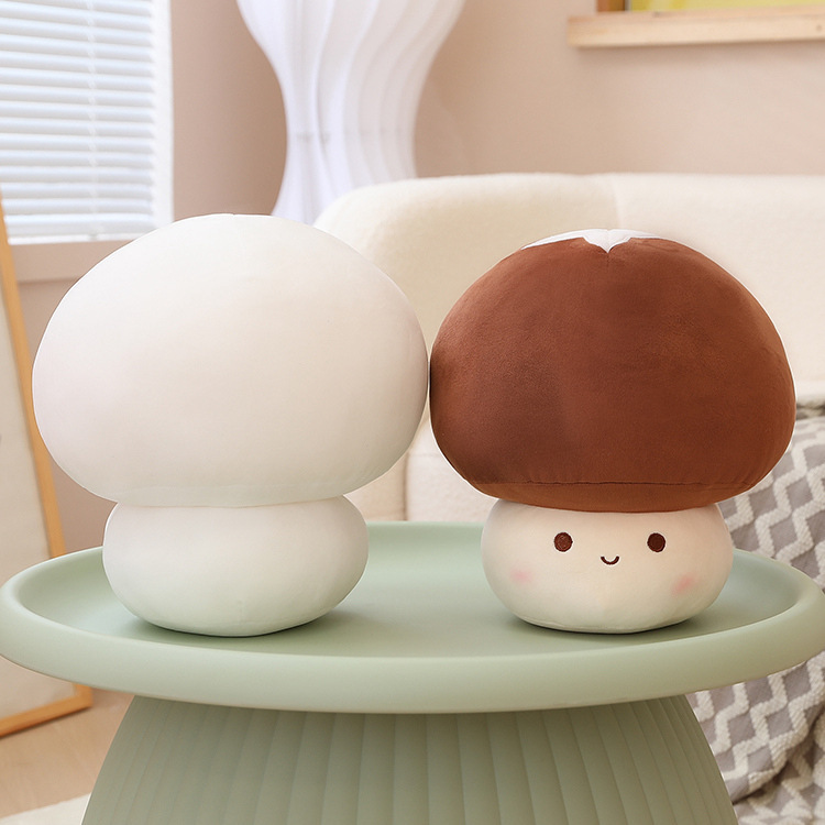 White and brown mushroom plush toys displayed on a small table, highlighting their soft shape, smooth texture, and cute design for cozy home decor