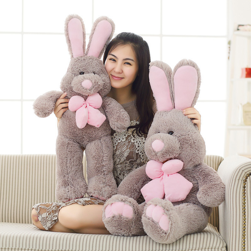 Rabbit plush toy with soft gray fabric and pink bow, perfect for hugging, relaxing, and adding a cozy touch to sofas and living spaces