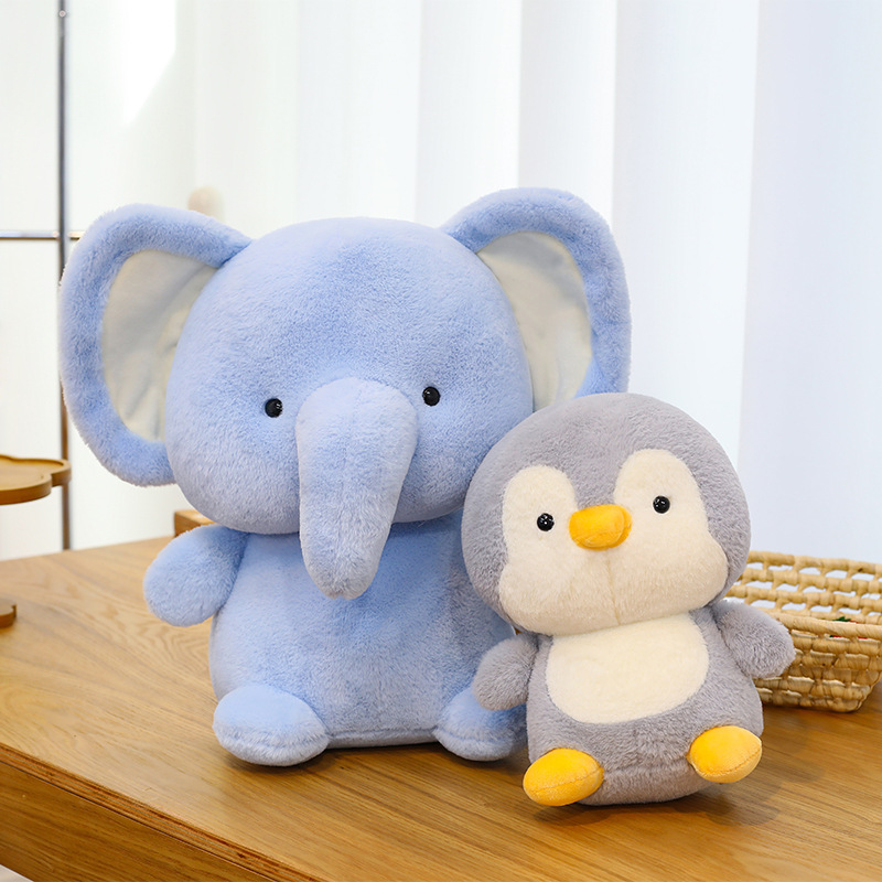 Elephant and penguin plush toys with smooth soft fabric and rounded shape, perfect for hugging and decorating a warm and cozy space
