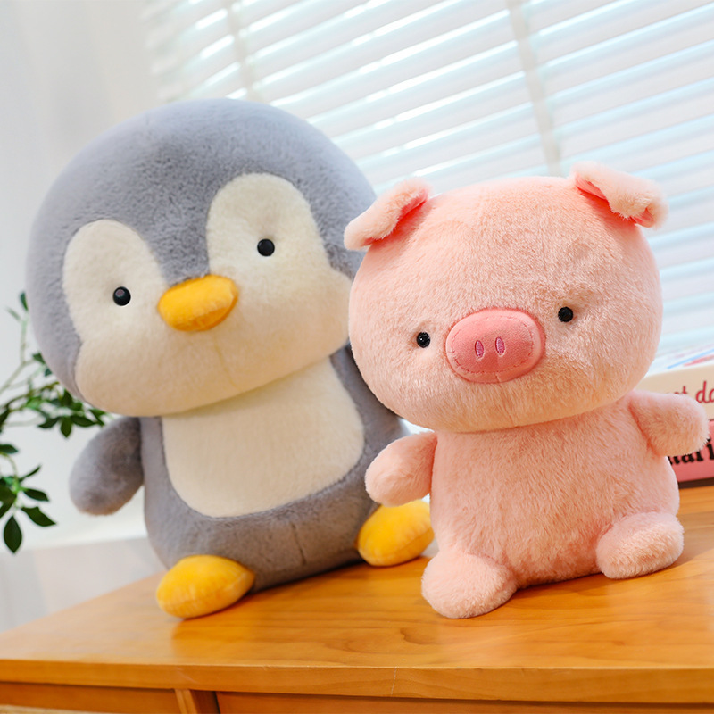 Penguin and pig plush toys in soft pastel colors, cute and cuddly companions ideal for relaxing, gifting and cozy room decor