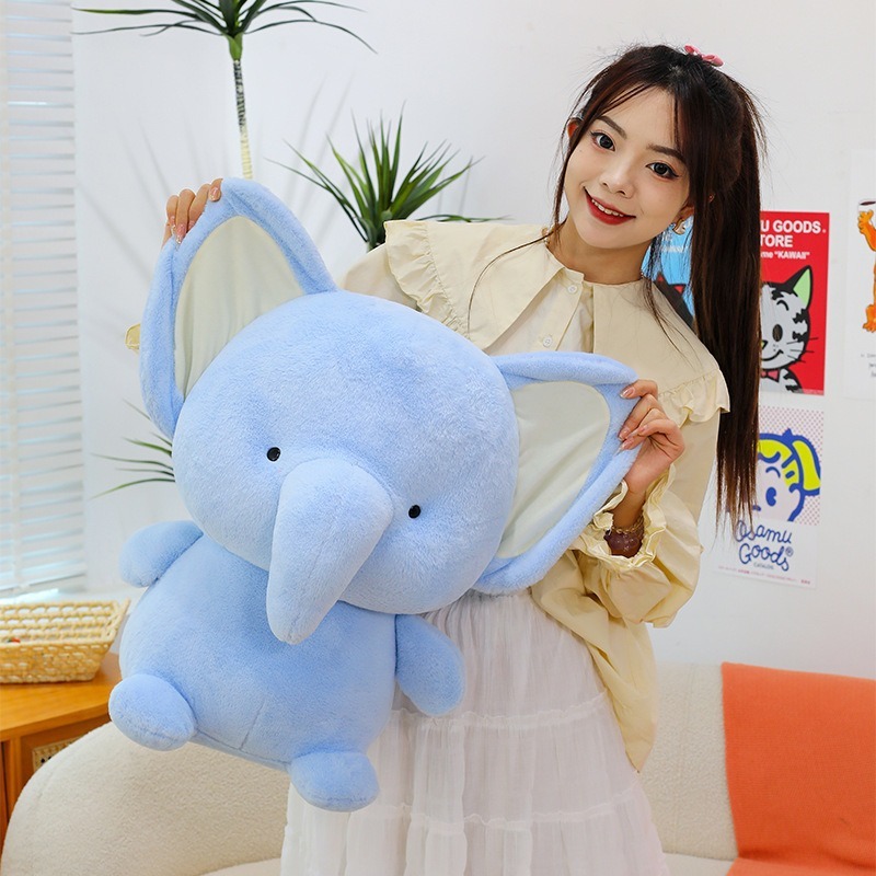 Elephant plush toy featuring soft plush texture and oversized ears, a cute and huggable companion for comfort and cozy room decoration
