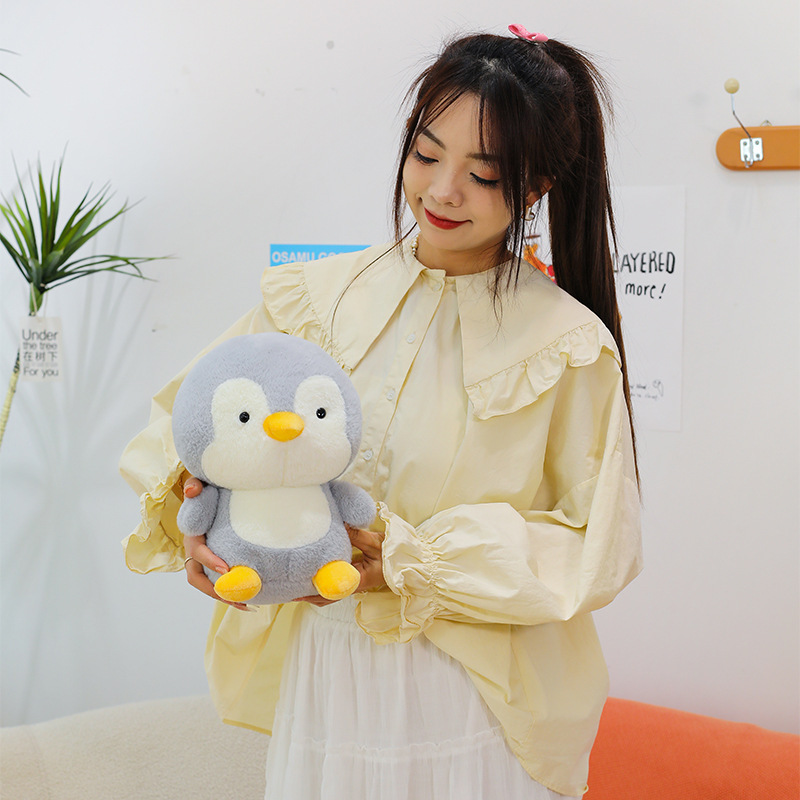 Small penguin plush toy with soft plush texture and compact rounded design, perfect for holding, relaxing and decorating small spaces