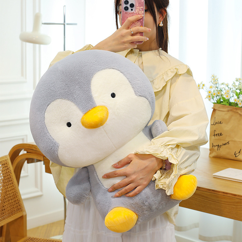Penguin plush toy with soft plush fabric and rounded design, cozy and cuddly companion ideal for hugging and home decoration