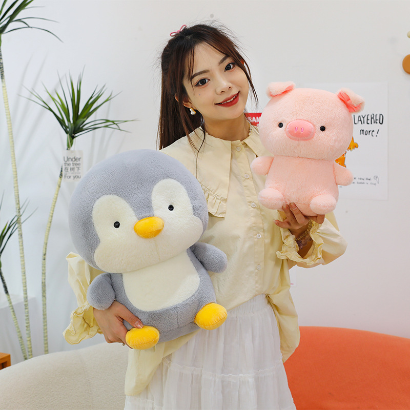 Penguin and pig plush toys with smooth plush texture and huggable design, ideal for cozy home decor and everyday comfort