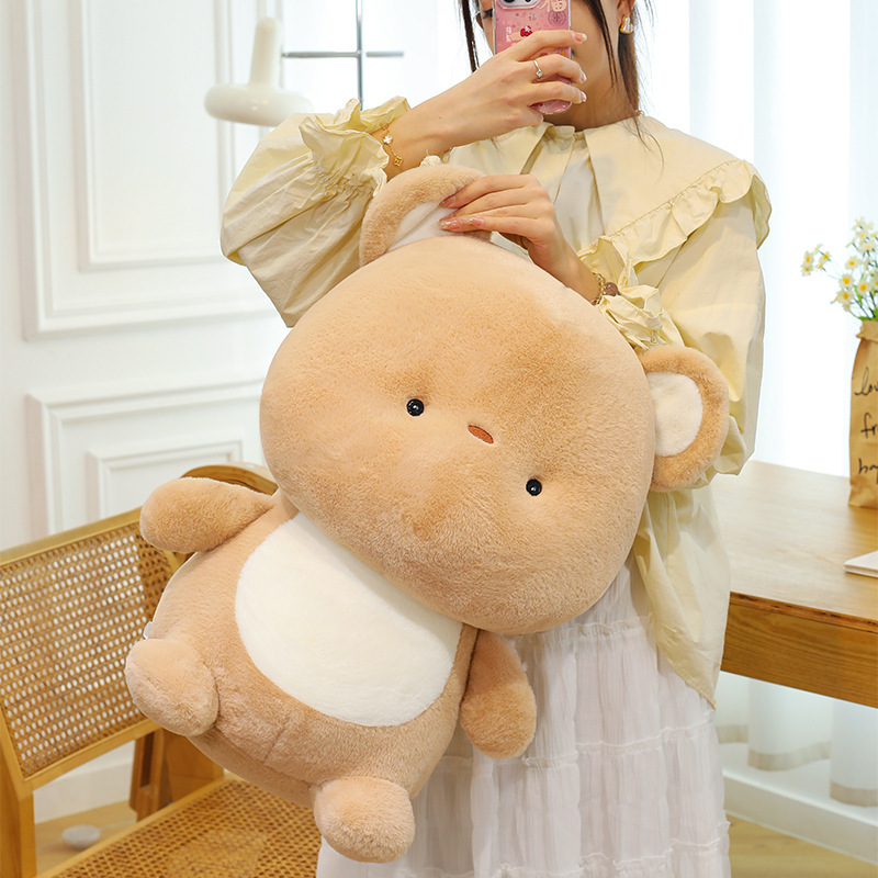 Bear plush toy with fluffy plush fabric and soft filling, designed for hugging, relaxing and adding a warm touch to any space