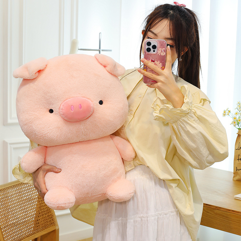 Pig plush toy in soft pastel pink with smooth plush texture, perfect for cuddling, relaxing and creating a cozy room atmosphere
