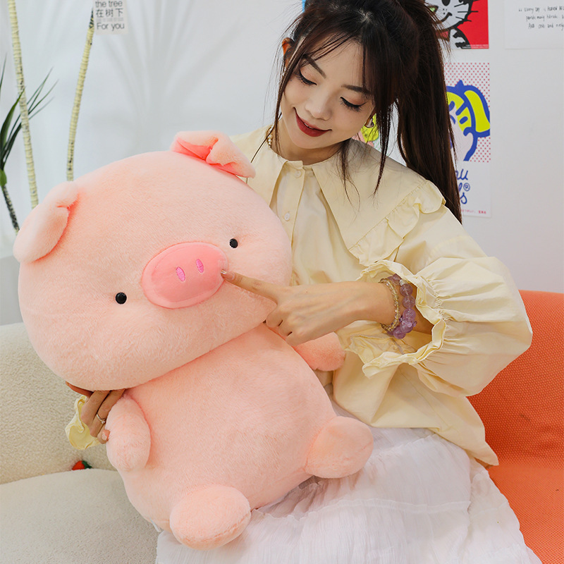 Pig plush toy with soft plush texture and huggable rounded design, ideal for cuddling, relaxing and adding a cozy touch to living spaces