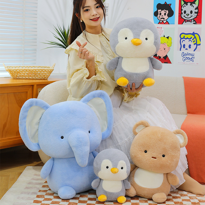 Animal plush toys including penguin, elephant, and bear in different sizes, made with soft plush fabric and designed for hugging, decorating, and cozy home comfort