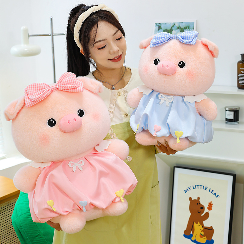 Bubble pig plush toy with bow dress in pink and blue, soft plush texture and round shape, ideal for hugging, relaxing, and cozy room decoration