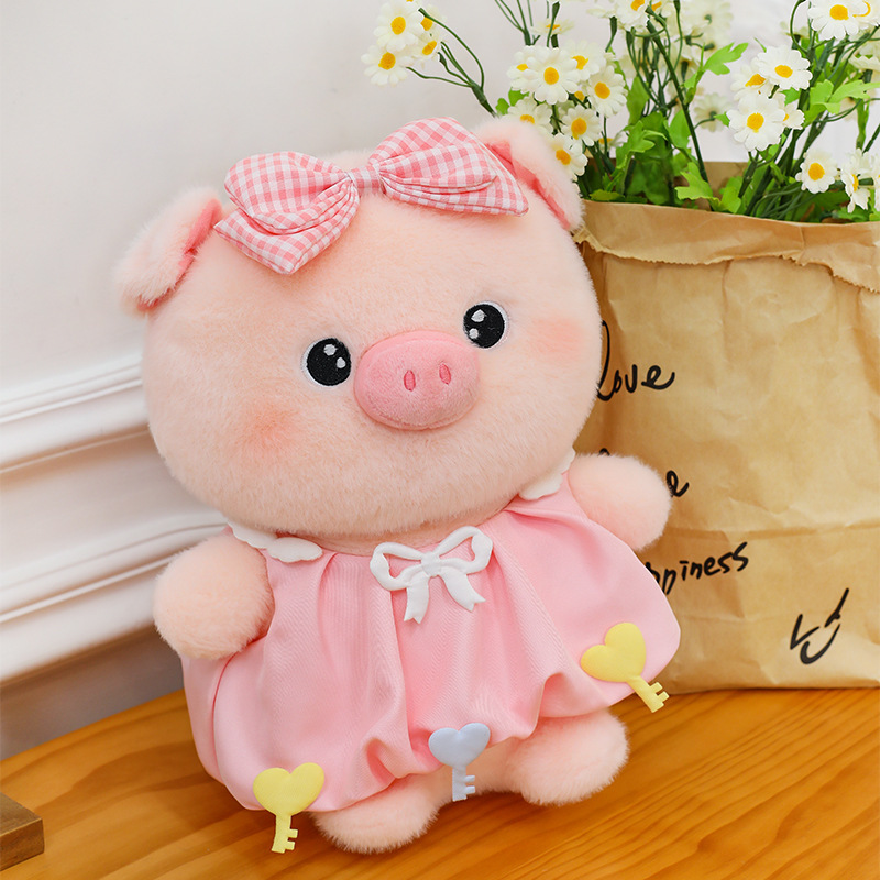 Bubble pig plush toy in pink dress with bow detail placed beside flowers, soft plush material and gentle colors, ideal for decoration and gifting