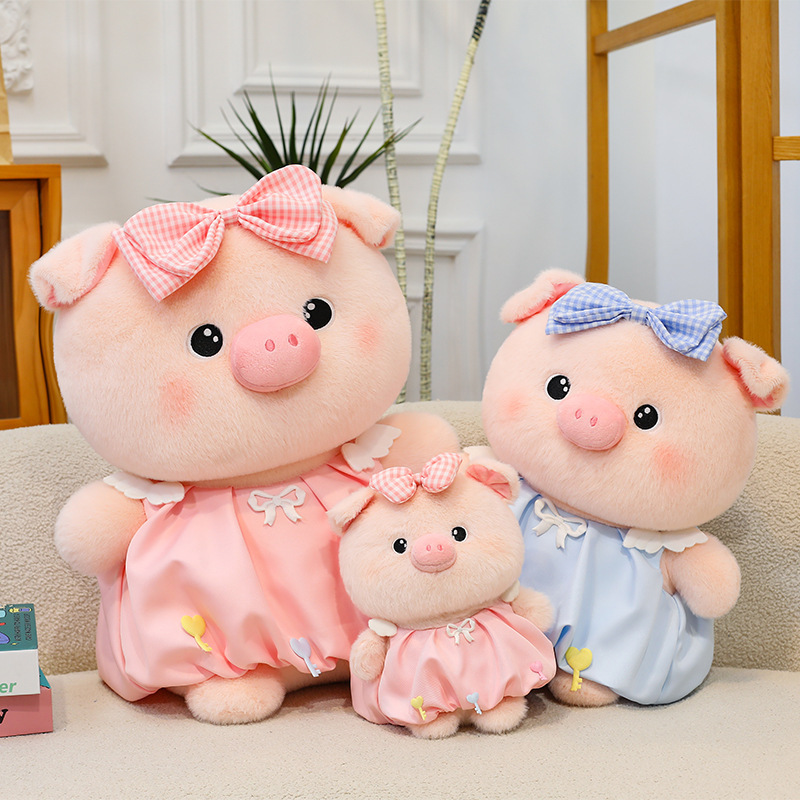 Bubble pig plush toy set in pink and blue with bow dress, soft plush fabric and rounded design, perfect for cuddling and decorating sofas and cozy living spaces