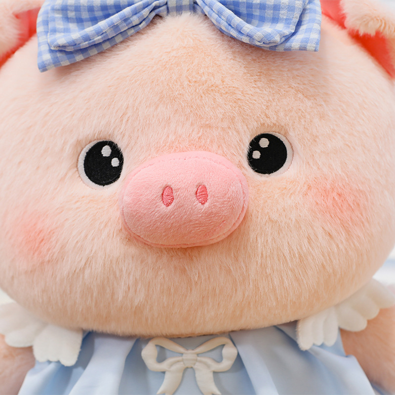 Bubble pig plush toy close up showing soft plush fabric, embroidered eyes and nose details, smooth texture and rounded design for a gentle and cuddly feel