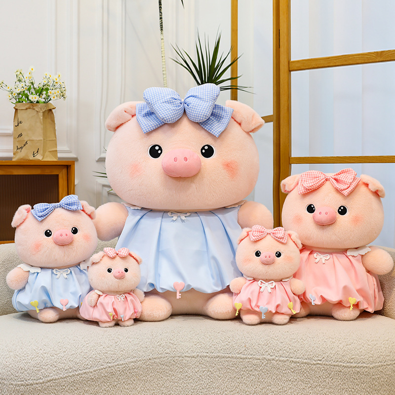 Bubble pig plush toy collection in pink and blue with bow dress, shown in multiple sizes, soft plush texture ideal for display, cuddling, and home decor styling