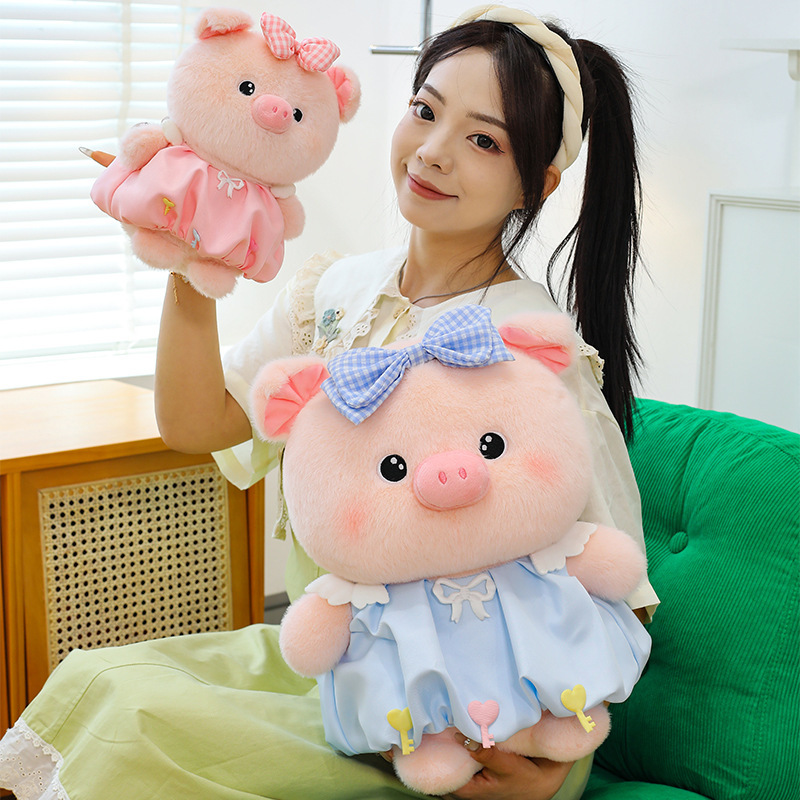 Bubble pig plush toy in pink and blue with bow dress, soft plush texture and round shape, ideal for hugging, relaxing, and cozy home decor