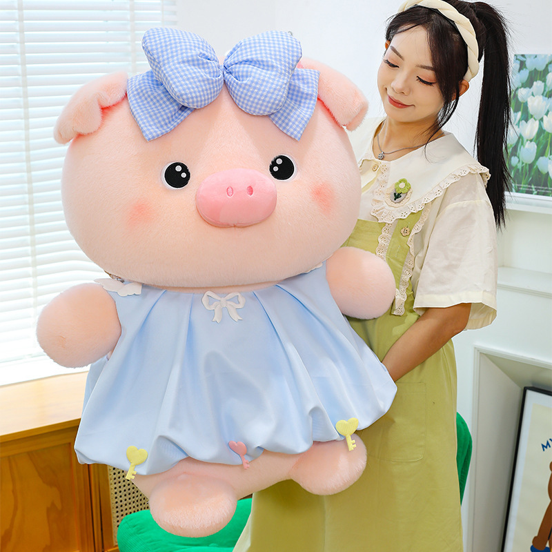 Bubble pig plush toy in blue with bow dress, soft plush texture and full shape, perfect for hugging, relaxing, and adding a cute touch to home decor