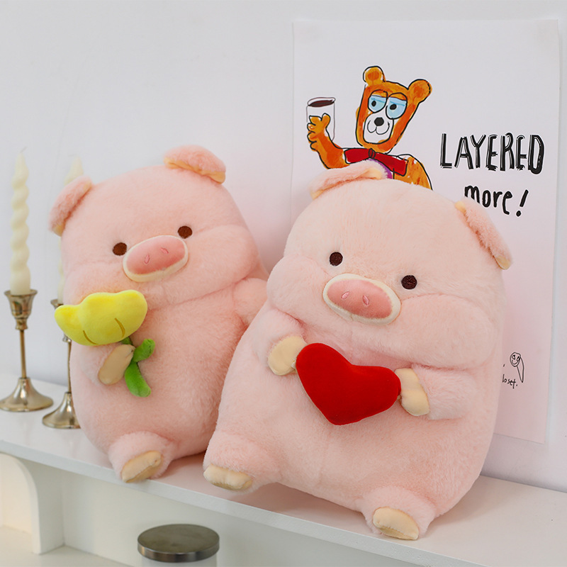 Pig plush toy pillows with heart and flower designs displayed on shelf for cozy home decor and gifting