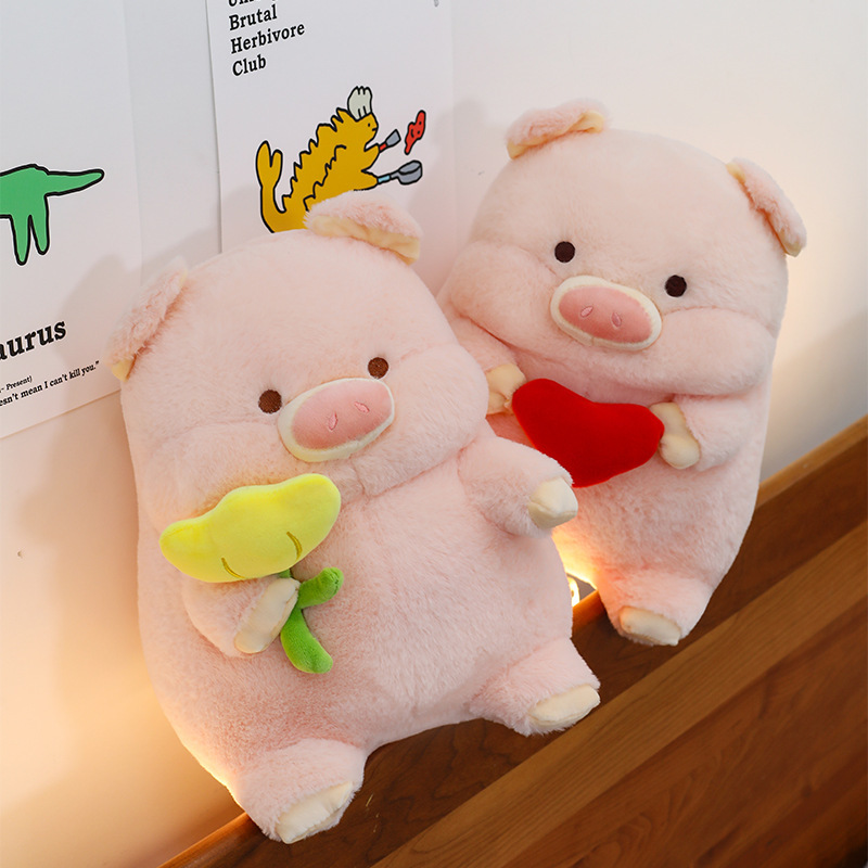 Pig plush toy pillows with heart and flower designs placed on bedside shelf with warm lighting for cozy decor