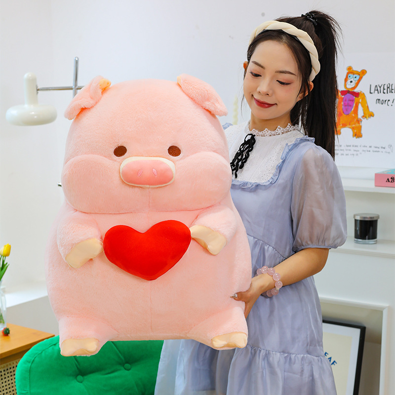 Cute pig plush toy with heart design in large size, soft stuffed animal pillow used as a cozy cushion for sofa or bedroom decor