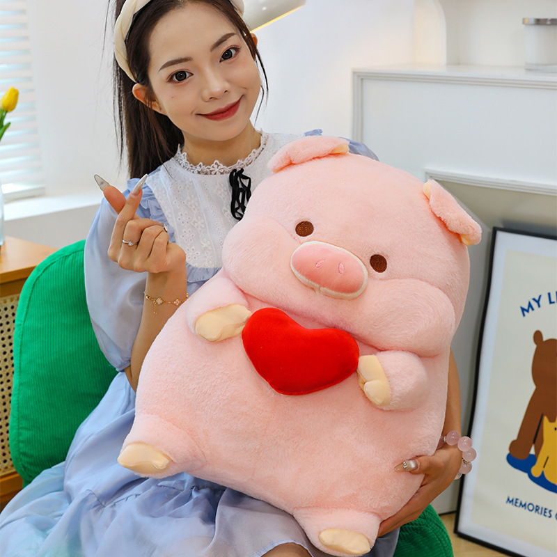 Cute pig plush toy with heart design, soft stuffed animal pillow held for hugging, cozy cushion for sofa, bedroom and relaxing use