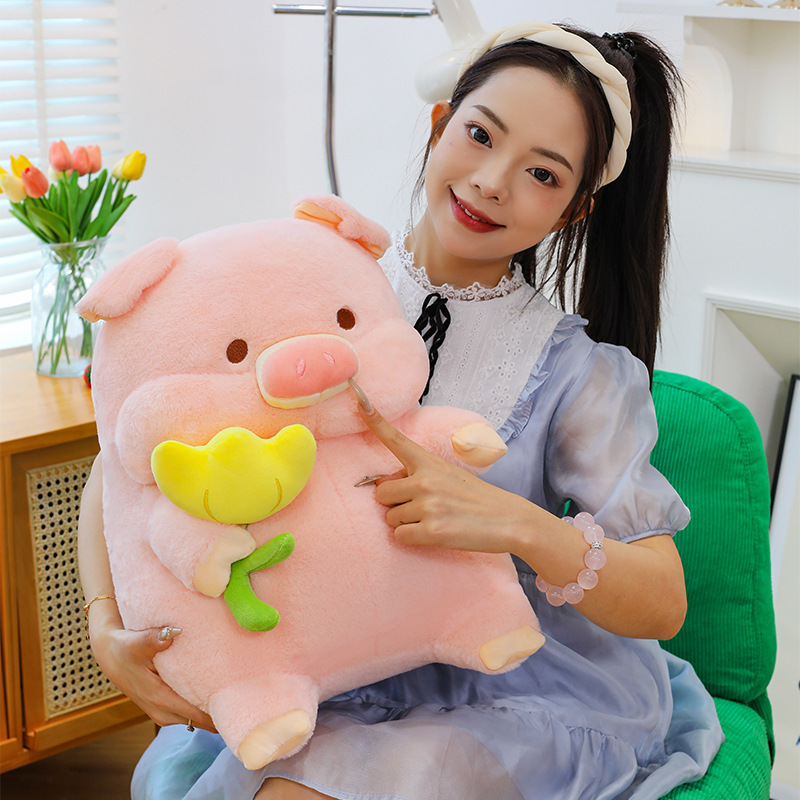 Cute pig plush toy with flower design, soft stuffed animal pillow showing plush texture and gentle touch, cozy for hugging and home decor