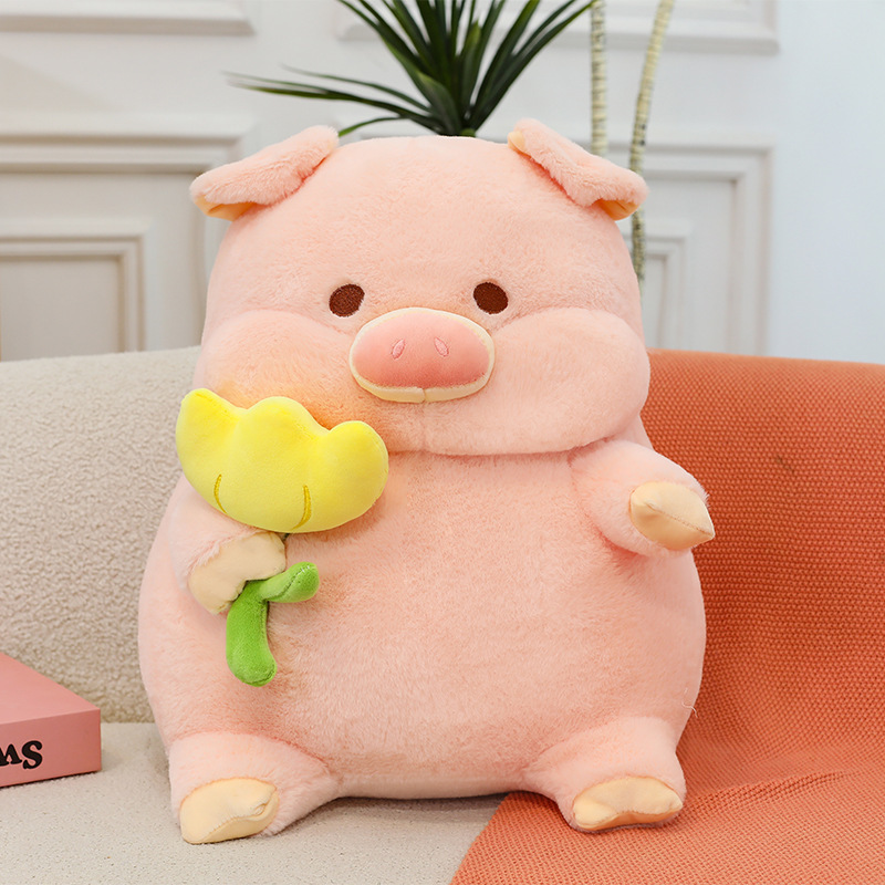 Pig plush toy with yellow flower design soft stuffed animal pillow placed on sofa for relaxation and decor