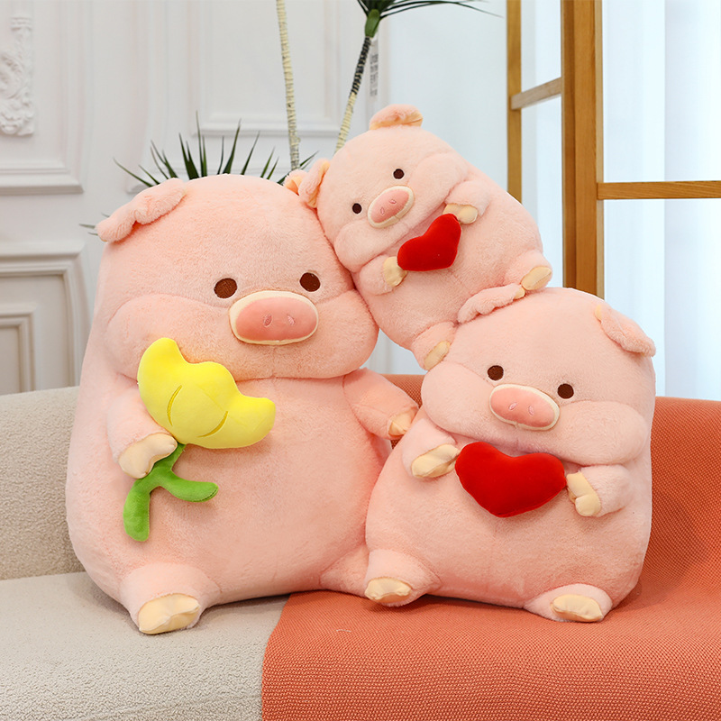Cute pig plush toy with heart and flower designs in different sizes, soft stuffed animal pillows arranged on sofa for cozy home decor