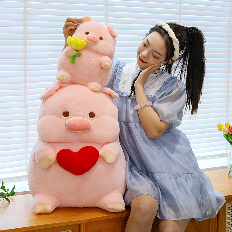 Cute pig plush toy stacked in different sizes, soft stuffed animal pillow with heart and flower designs, cozy home decor for sofa or bedroom