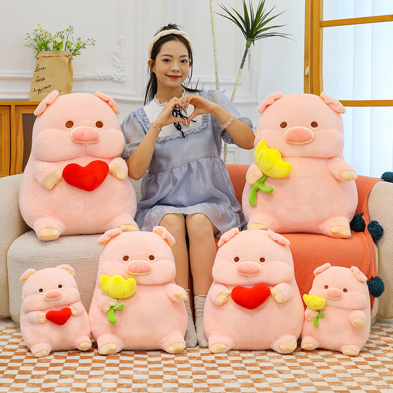 Cute pig plush toy with heart and flower designs, soft stuffed animal pillows arranged on sofa and floor, cozy home decor and gift idea
