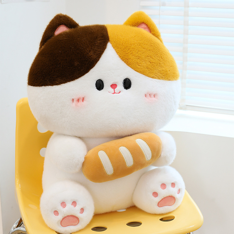 Baguette cat plush toy sitting on chair with soft plush material rounded shape and bread detail suitable for cozy home decor