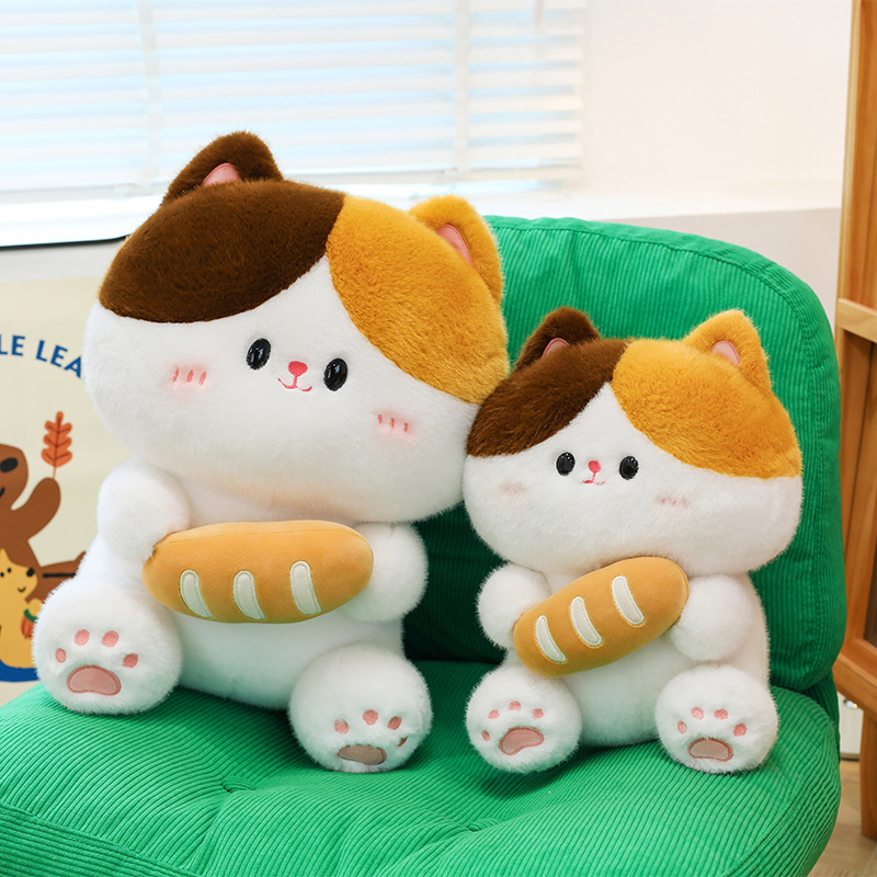 Baguette cat plush toy in two sizes on green chair highlighting soft plush fabric bread design and size variation for home decor use