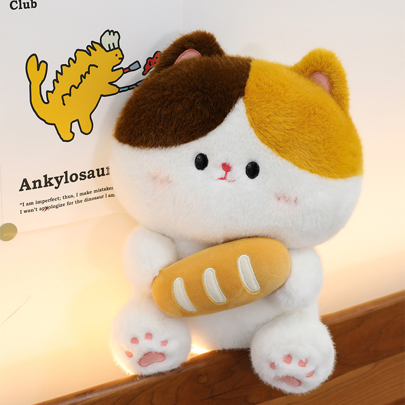 Baguette cat plush toy sitting on wooden edge with soft lighting highlighting plush texture cute face details and cozy room atmosphere