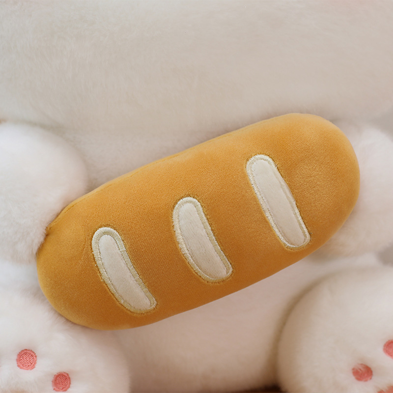 Close up of baguette design on plush toy showing soft plush texture and detailed stitching on bread element
