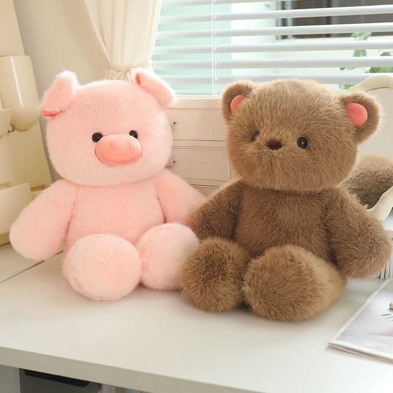 Pig and bear plush toys on a desk in a warm indoor setting, soft plush fabric with a cuddly design, ideal for decorating spaces and relaxing moments