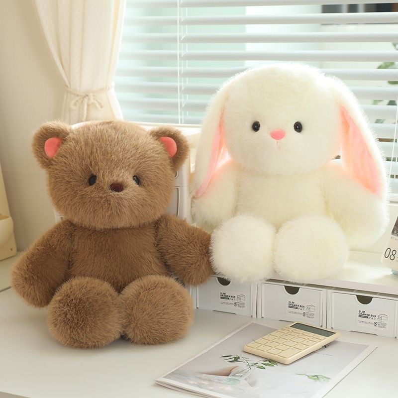 Bear and rabbit plush toys displayed in a cozy indoor setting, soft fluffy texture with a cute rounded design, perfect for cuddling and home decor