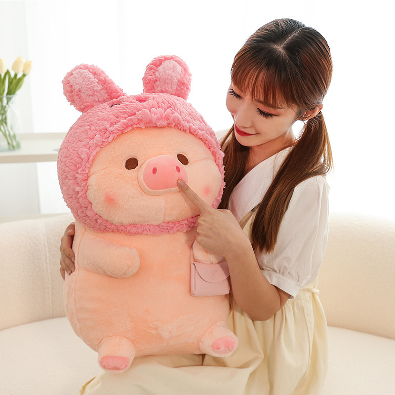 Pig plush toy in rabbit costume with soft plush texture and fluffy finish, cute stuffed animal for cuddling and cozy relaxation