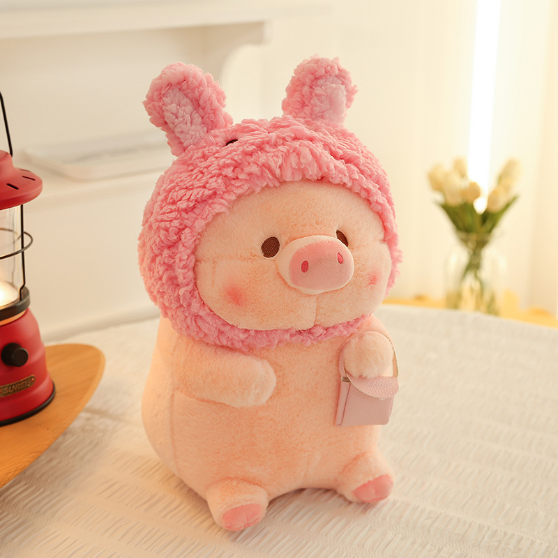Pig plush toy in rabbit costume with soft plush texture, displayed on a cozy bed setting, ideal for cuddling and cute home decor
