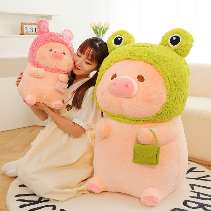 Pig plush toy in animal costume featuring soft plush texture and rounded shape, shown in a cozy indoor setting, ideal for hugging, relaxing, and adding warmth to home decor