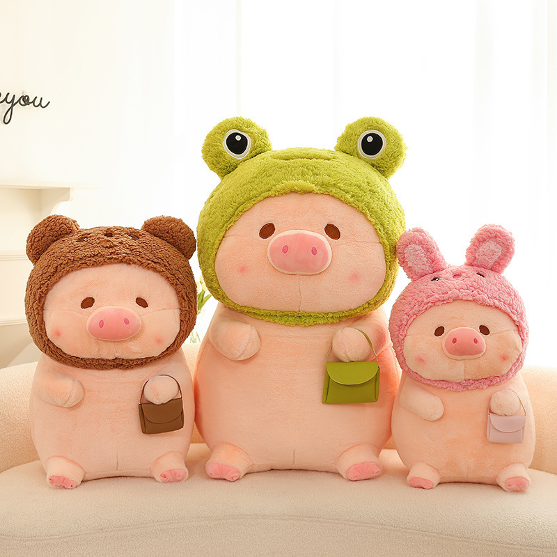 Pig plush toy in animal costume featuring frog, bear, and rabbit designs, soft stuffed plush with rounded shape, suitable for cuddling, decoration, and cozy home spaces