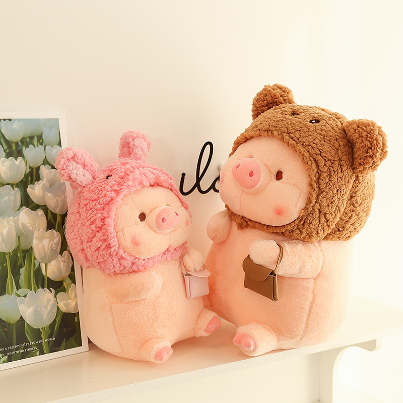 Pig plush toy in animal costume with soft plush fabric and cute rounded design, styled on a shelf in a warm indoor setting, ideal for display, gifting, and cozy home decor