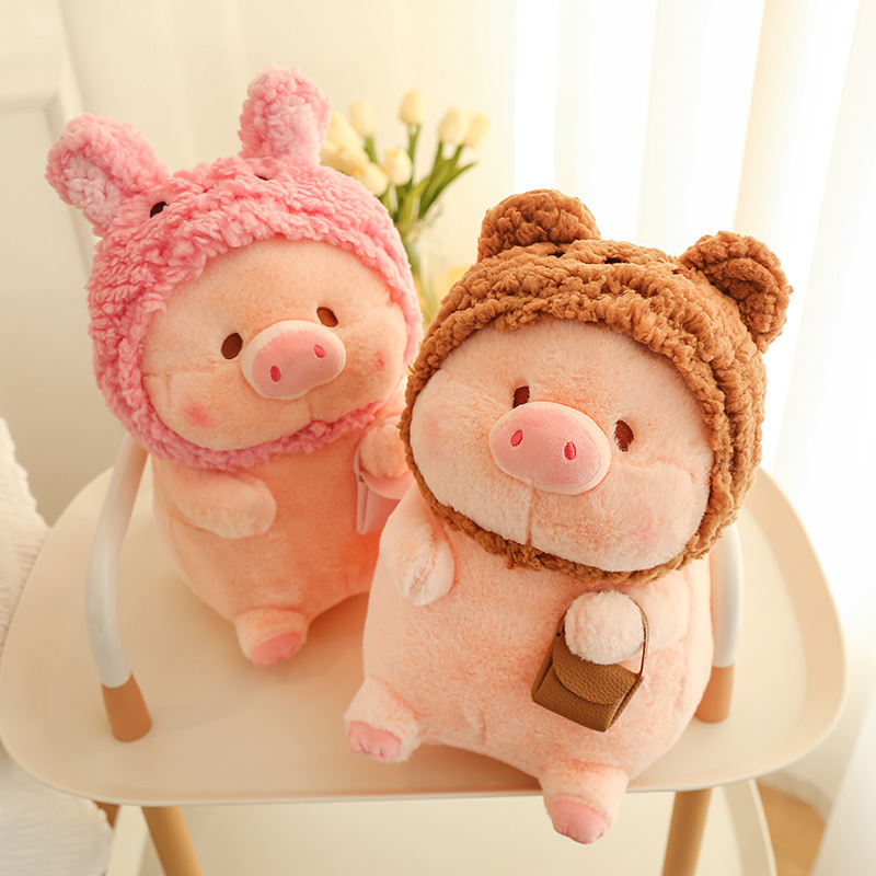 Pig plush toy in animal costume with soft plush texture and rounded shape, displayed on a chair in a cozy indoor setting, ideal for cuddling, relaxing, and home decoration